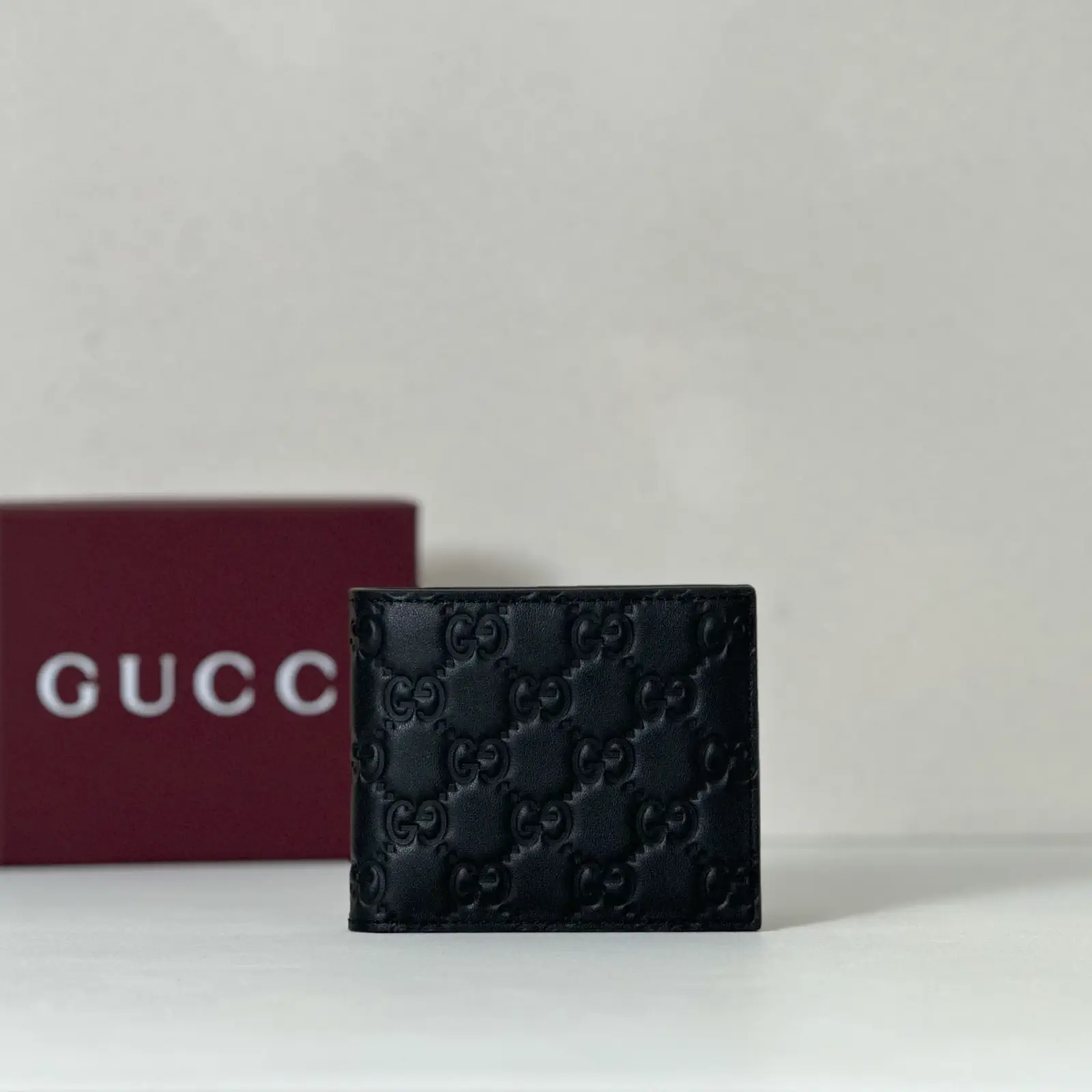 Gucci Black Embossed Monogram Bifold Wallet image 1
