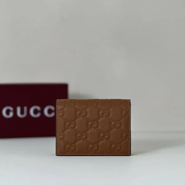 Gucci Brown Embossed Monogram Wallet image 1