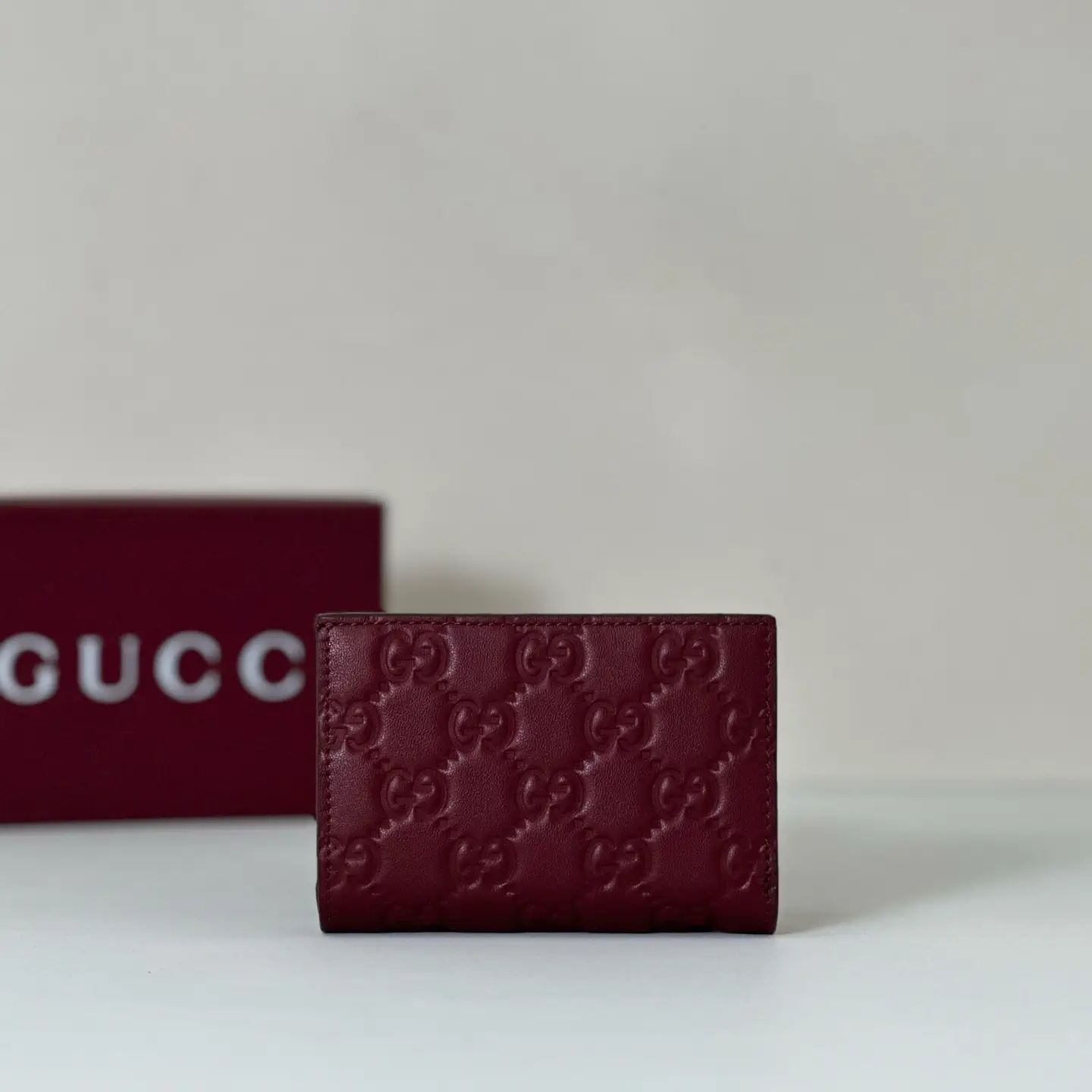 Gucci Burgundy Embossed Monogram Card Holder image 1