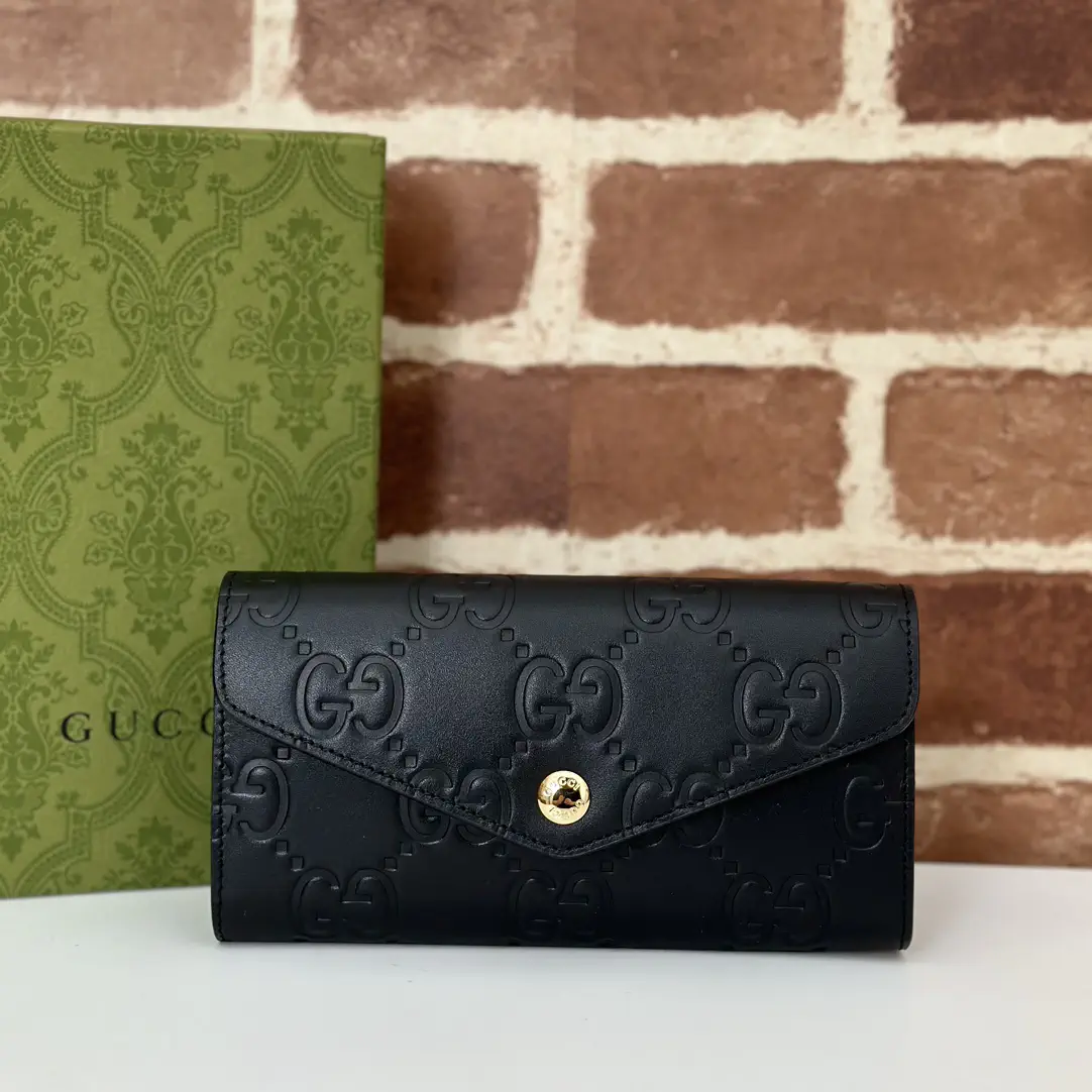 Gucci Black Embossed GG Wallet image 1