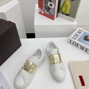 White Low-Top Sneakers with Gold Accent image 1
