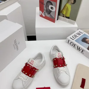 White Low-Top Sneakers with Red Strap and Stud Details image 1