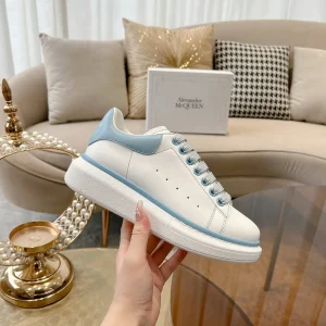 White Platform Sneakers with Light Blue Accents image 1
