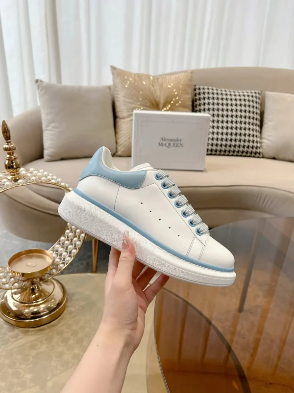 White Platform Sneakers with Light Blue Accents image 1