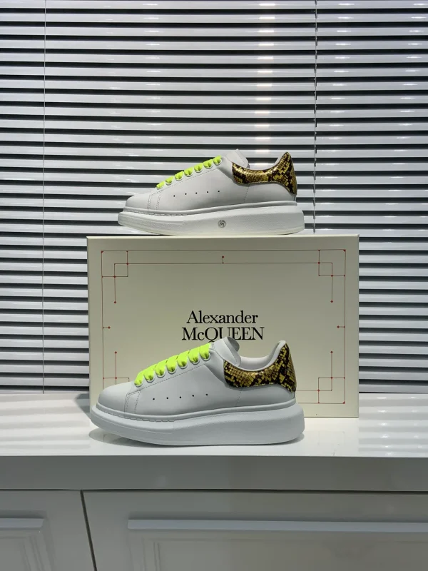 White Platform Sneakers with Snake Print Heel Tab and Neon Laces image 1