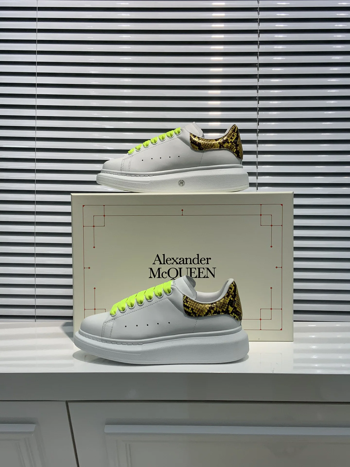 White Platform Sneakers with Snake Print Heel Tab and Neon Laces image 1