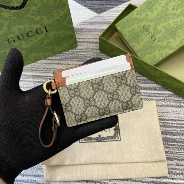 Gucci GG Emblem Card Holder with Wrist Strap image 1