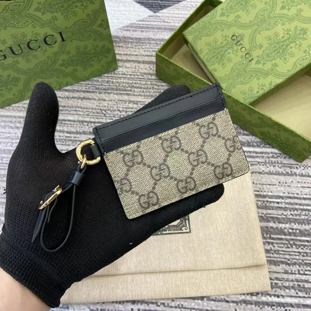 Gucci GG Emblem Card Holder with Wrist Strap image 1