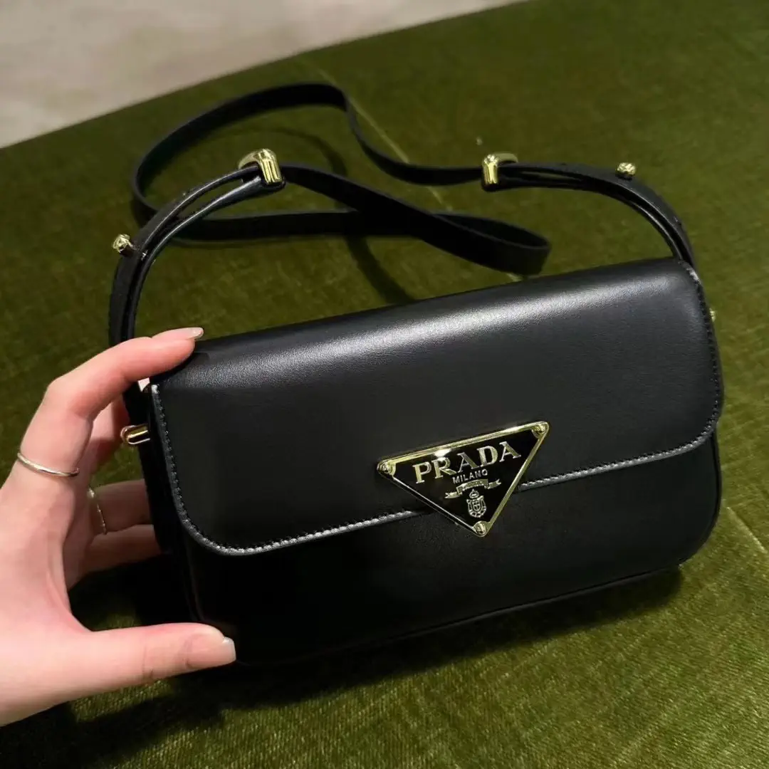 Prada Black Shoulder Bag with Gold-Tone Logo Plaque image 1